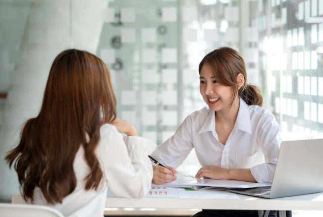 young-asian-woman-doing-job-interview-office_37714-2093